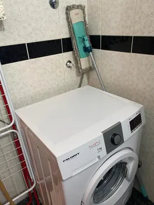 a washing machine in a bathroom with a washer at Apartman Felix in Zvezdara