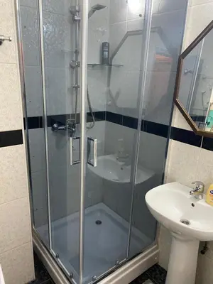 a bathroom with a shower and a sink at Apartman Felix in Zvezdara