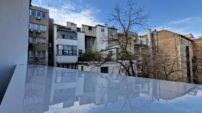 a view of a city from the balcony of a building at CashIN apartment in Belgrade