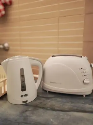 two toasters sitting on a counter next to each other at Stadion apartman in Belgrade