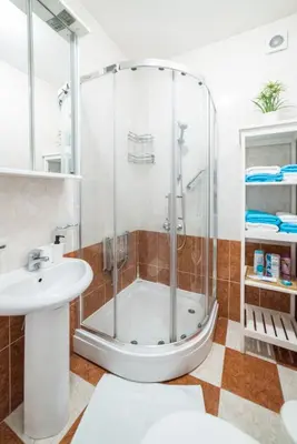 a bathroom with a shower and a sink at Panorama Central - Vračar Apartment in Belgrade
