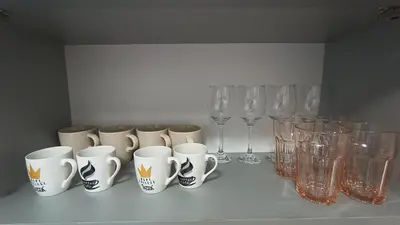 a group of cups and wine glasses on a table at Kraljevica Marka Apartman in Belgrade