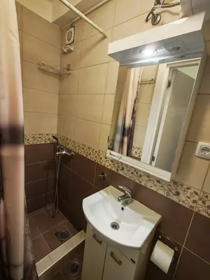 a bathroom with a sink and a mirror at Kraljevica Marka Apartman in Belgrade