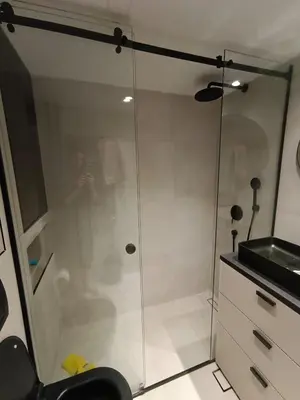 a shower with a glass door in a bathroom at Green Place in Vračar (historical)