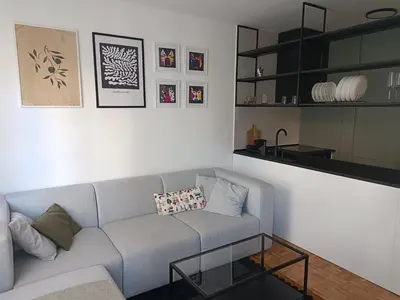a living room with a couch and a table at Green Place in Vračar (historical)