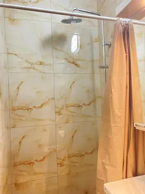 a shower with a glass door in a bathroom at Urban Aura Belgrade in Belgrade