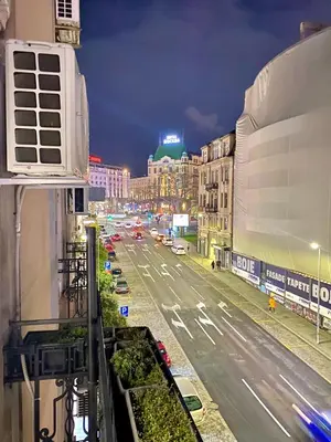 a view of a city street at night at Urban Aura Belgrade in Belgrade