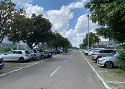 a row of cars parked on the side of a street at Premium stan Novi Beograd in Novi Beograd