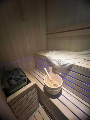 a small room with two beds and a bowl and utensils at Lux studio sa saunom Ampelitsi in Ledine