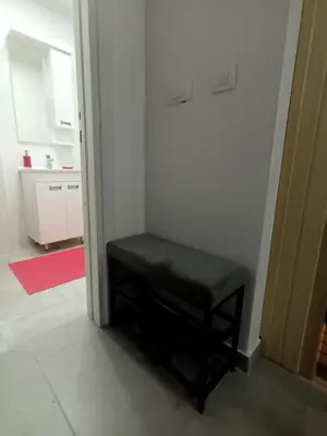 a black stool sitting in the corner of a room at Lux studio sa saunom Ampelitsi in Ledine