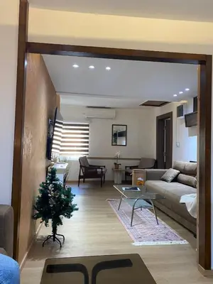 a living room with a couch and a christmas tree at Kapetan-Misa in Belgrade