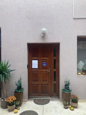 a wooden door of a building with plants in front of it at Kapetan-Misa in Belgrade