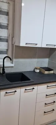 a kitchen with a sink and a counter top at Finans1 in Ruma
