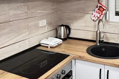 a kitchen with a sink and a counter top at Aero Fly apartment Belgrade in Belgrade