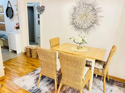 a dining room with a table and chairs at Aero Fly apartment Belgrade in Belgrade