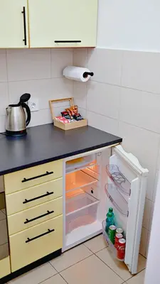 a kitchen with an open refrigerator with its door open at Apartment SOFI Belville in Novi Beograd