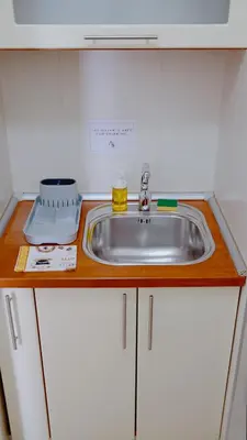 a kitchen counter with a sink in a kitchen at Apartment SOFI Belville in Novi Beograd