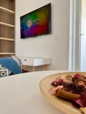 a plate of food on a table in a room at Apartment SOFI Belville in Novi Beograd