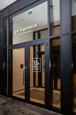 an entrance to a building with a sign on the door at Belgrade Simfonia - One bedroom apartment in Belgrade