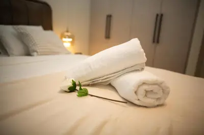 a towel sitting on top of a bed at Belgrade Simfonia - One bedroom apartment in Belgrade