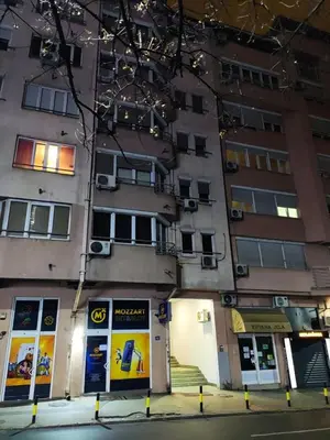 a tallartment building with windows and a street at Panorama 40 in Sajmište