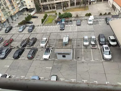 an aerial view of a parking lot with cars parked at Panorama 40 in Sajmište