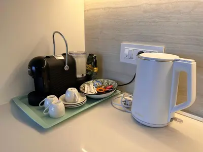 a counter with a coffee maker on a shelf at Beldorado Apartments - Belgrade Waterfront Luxury Apartment Amber in Belgrade