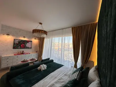 a bedroom with a bed and a large window at Beldorado Apartments - Belgrade Waterfront Luxury Apartment Amber in Belgrade