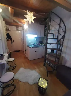 a living room with a room with a star on the ceiling at Knez Mihailova apartment - City Center in Belgrade