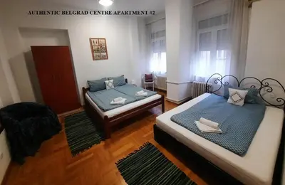 a room with two beds in a room at Authentic Belgrade Centre Apartments for large groups, Republic Square - Up to 47 People in 5 Apartments in Belgrade