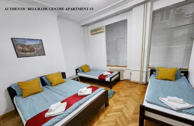 a room with two beds in a room at Authentic Belgrade Centre Apartments for large groups, Republic Square - Up to 47 People in 5 Apartments in Belgrade