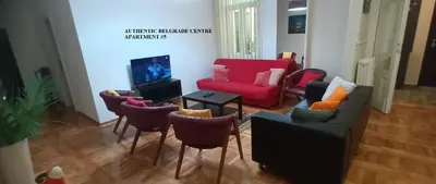 a living room with a couch and chairs and a tv at Authentic Belgrade Centre Apartments for large groups, Republic Square - Up to 47 People in 5 Apartments in Belgrade