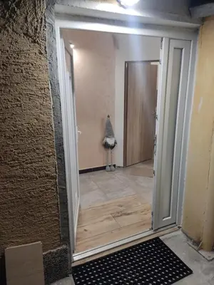 a hallway with a door into a room at The nest in Dušanovac (historical)