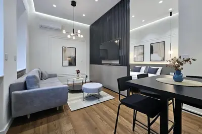 a living room with a couch and a table at Central life in Belgrade