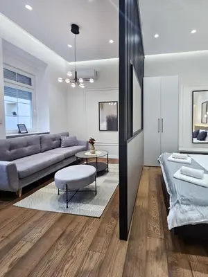 a living room with a couch and a table at Central life in Belgrade