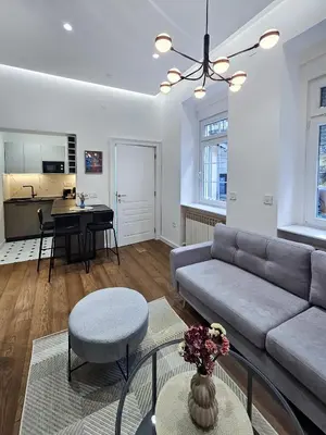 a living room with a couch and a table at Central life in Belgrade