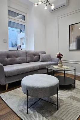 a living room with a couch and a table at Central life in Belgrade