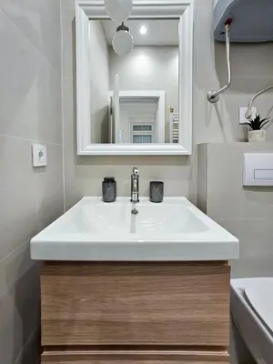 a bathroom with a white sink and a mirror at Easy life in Belgrade
