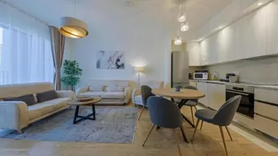 a living room with a couch and a table at SD Luxury Apartment - Belgrade Waterfront in Belgrade