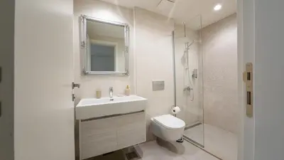 a bathroom with a sink and a toilet and a shower at SD Luxury Apartment - Belgrade Waterfront in Belgrade