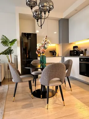 a kitchen and dining room with a table and chairs at SD Luxury Apartment - Belgrade Waterfront - KARE Design - River View in Belgrade
