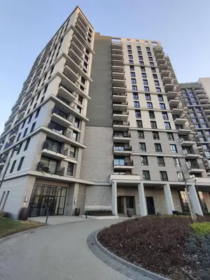 a large apartment building with a driveway in front of it at SD Luxury Apartment - Belgrade Waterfront - KARE Design - River View in Belgrade