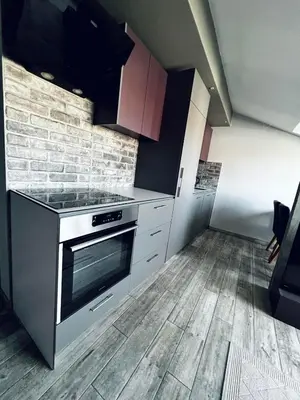 a kitchen with a stove and a counter top at New Grey in Novi Beograd