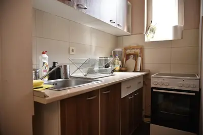 a kitchen with a sink and a stove at Belgrade Center Bohemian Quarter in Belgrade