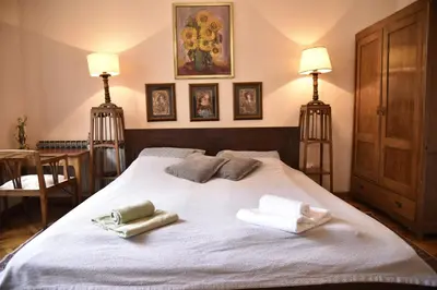 a bedroom with a bed with towels on it at Belgrade Center Bohemian Quarter in Belgrade