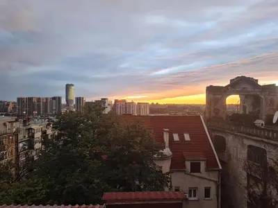 a view of a city with a sunset in the background at Centrum 3 in Belgrade