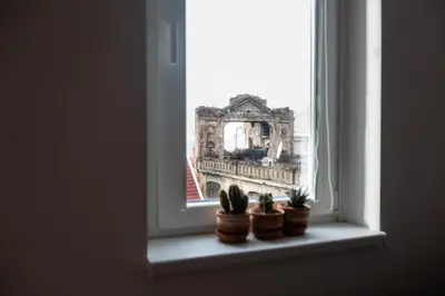 an open window with potted plants on a window sill at Centrum 3 in Belgrade