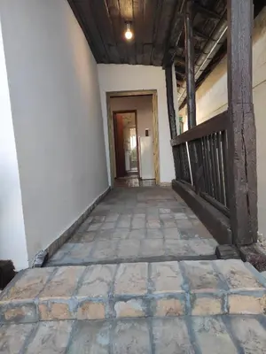 an empty hallway of a building with a door at Apostolovic kuca kulturni spomenik u centru Grocke in Grocka