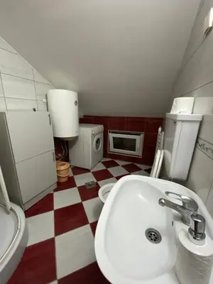a bathroom with a toilet and a sink at GM Apartman Obrenovac in Obrenovac