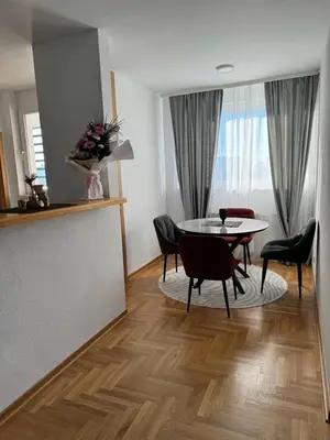 a living room with a table and chairs at Arena Mila in Novi Beograd